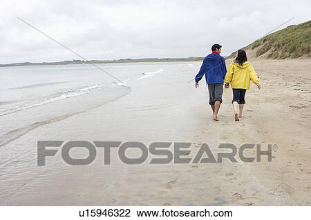 Couple on beach in love View Large Photo Image Stock Image - Couple on beach in love. Fotosearch