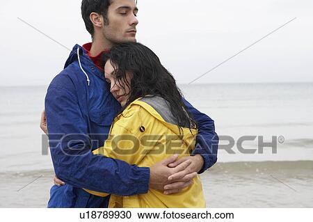 Stock Image - Couple on beach in love. Fotosearch