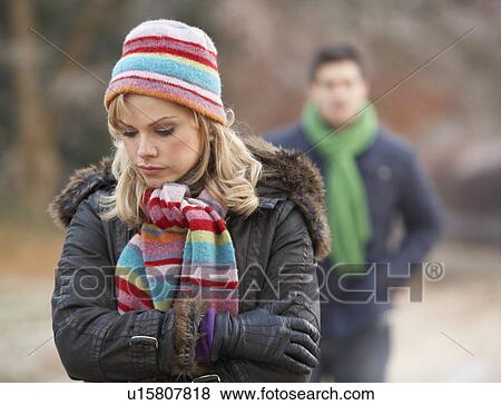 Stock Photo - Couple On Romantic Winter Walk Through Frosty Landscape. Fotosearch