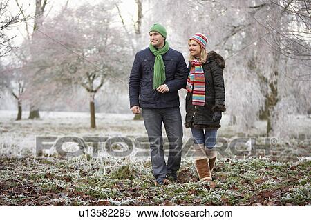 Couple On Winter Walk Through Frosty Landscape View Large Photo Image Stock Photography - Couple On Winter Walk Through Frosty Landscape. Fotosearch