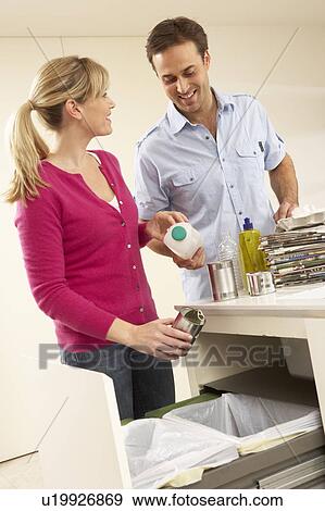 Couple Recyling Waste At Home View Large Photo Image Stock Photo - Couple Recyling Waste At Home. Fotosearch