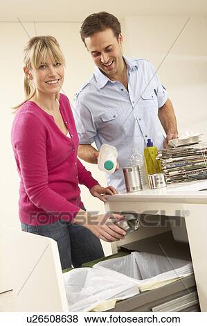 Couple Recyling Waste At Home View Large Photo Image Stock Photo - Couple Recyling Waste At Home. Fotosearch