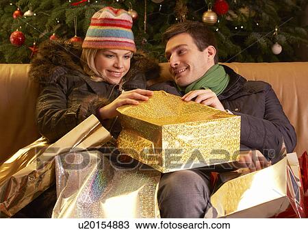 Couple Returning After Christmas Shopping Trip View Large Photo Image Stock Image - Couple Returning After Christmas Shopping Trip. Fotosearch