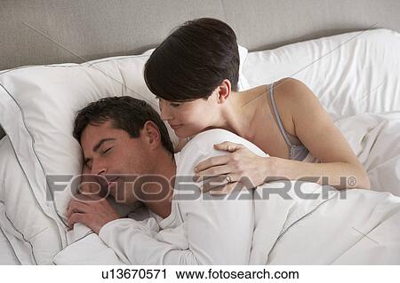 Stock Image - Couple With Problems Having Disagreement In Bed. Fotosearch