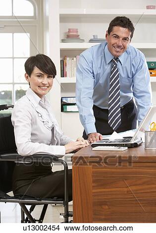 Couple Working From Home Using Laptop View Large Photo Image Picture - Couple Working From Home Using Laptop. Fotosearch