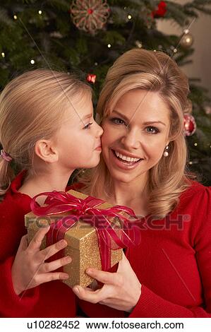 Daughter Giving Mother Christmas Gift View Large Photo Image Stock Image - Daughter Giving Mother Christmas Gift. Fotosearch
