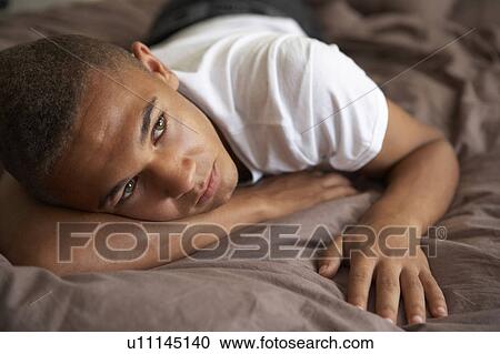 Depressed Teenage Boy Lying In Bedroom View Large Photo Image Stock Image - Depressed Teenage Boy Lying In Bedroom. Fotosearch