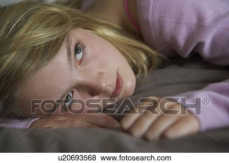 Depressed Teenage Girl Lying In Bedroom View Large Photo Image Stock Photo - Depressed Teenage Girl Lying In Bedroom. Fotosearch