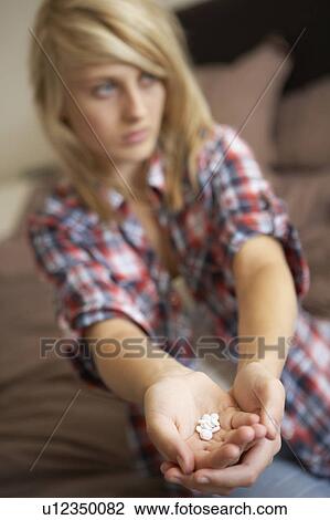 Depressed Teenage Girl Sitting In Bedroom With Pills View Large Photo Image Stock Image - Depressed Teenage Girl Sitting In Bedroom With Pills. Fotosearch