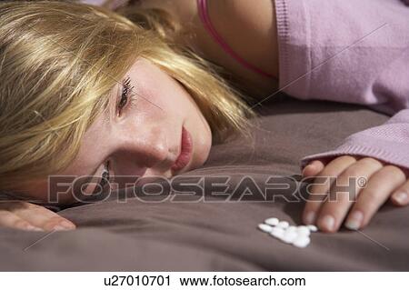 Depressed Teenage Girl Sitting In Bedroom With Pills View Large Photo Image Stock Image - Depressed Teenage Girl Sitting In Bedroom With Pills. Fotosearch