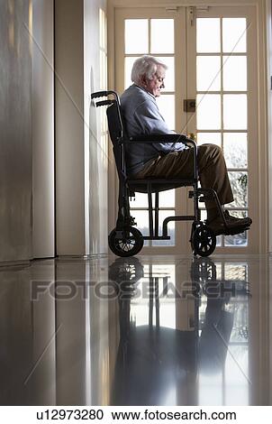 Stock Image - Disabled Senior Man Sitting In Wheelchair. Fotosearch