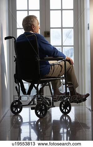 Stock Image - Disabled Senior Man Sitting In Wheelchair. Fotosearch