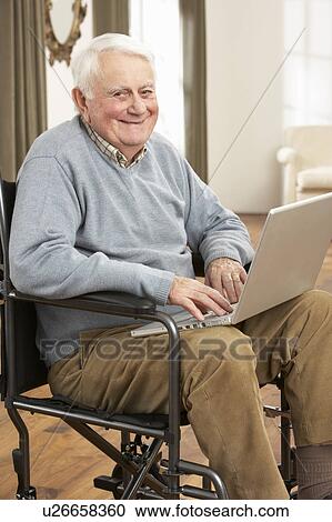 Disabled Senior Man Sitting In Wheelchair Using Laptop View Large Photo Image Stock Image - Disabled Senior Man Sitting In Wheelchair Using Laptop. Fotosearch
