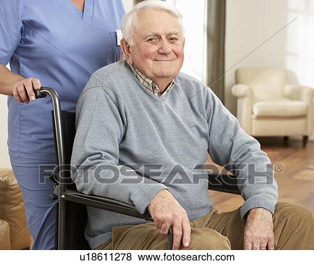 Disabled Senior Man Sitting In Wheelchair With Carer Behind View Large Photo Image Stock Photo - Disabled Senior Man Sitting In Wheelchair With Carer Behind. Fotosearch