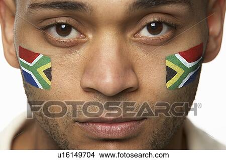 Picture - Disappointed Young Male Sports Fan With South African Flag Painted On Face. Fotosearch