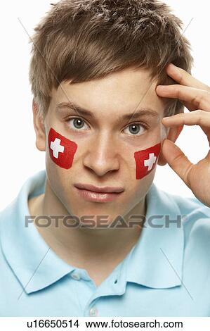 Picture - Disappointed Young Male Sports Fan With Swiss Flag Painted On Face. Fotosearch