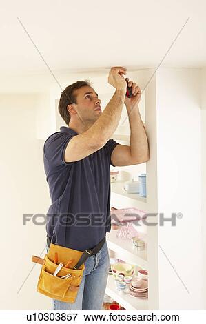 Electrician Installing Light Fitting In Home View Large Photo Image Stock Photo - Electrician Installing Light Fitting In Home. Fotosearch