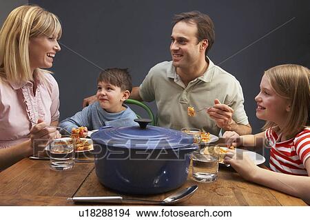 Family Enjoying Meal Together At Home View Large Photo Image Picture - Family Enjoying Meal Together At Home. Fotosearch