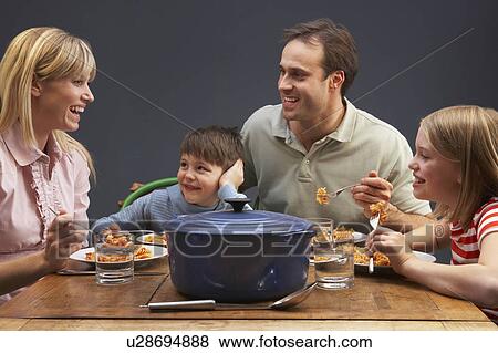 Family Enjoying Meal Together At Home View Large Photo Image Stock Photo - Family Enjoying Meal Together At Home. Fotosearch