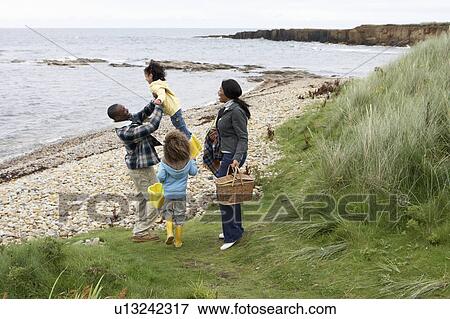 Stock Photo - Family having picnic. Fotosearch