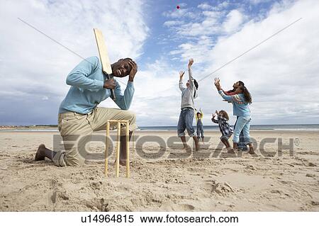 Family playing cricket on beach View Large Photo Image Stock Photography - Family playing cricket on beach. Fotosearch