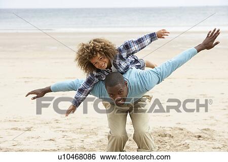 Father and son playing together View Large Photo Image Stock Photograph - Father and son playing together. Fotosearch