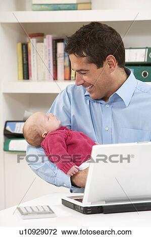 Father With Newborn Baby Working From Home Using Laptop View Large Photo Image Stock Image - Father With Newborn Baby Working From Home Using Laptop. Fotosearch