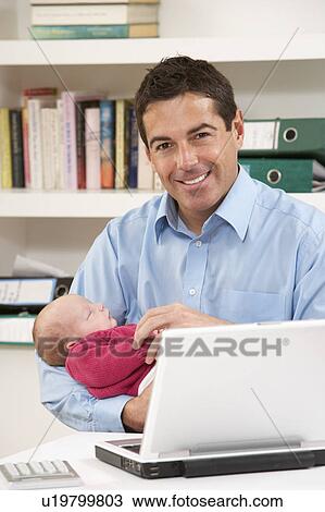 Father With Newborn Baby Working From Home Using Laptop View Large Photo Image Stock Image - Father With Newborn Baby Working From Home Using Laptop. Fotosearch