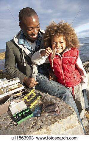 Father with son fishing View Large Photo Image Stock Image - Father with son fishing. Fotosearch