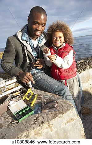Stock Photograph - Father with son fishing. Fotosearch
