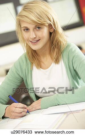 Female Teenage Student Studying In Classroom View Large Photo Image Stock Image - Female Teenage Student Studying In Classroom. Fotosearch