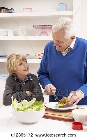 Grandfather And Grandson Making Sandwich In Kitchen View Large Photo Image Stock Image - Grandfather And Grandson Making Sandwich In Kitchen. Fotosearch
