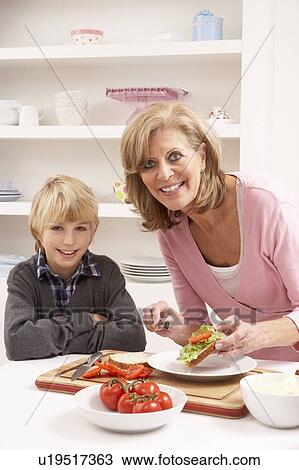 Grandmother And Grandson Making Sandwich In Kitchen View Large Photo Image Stock Image - Grandmother And Grandson Making Sandwich In Kitchen. Fotosearch