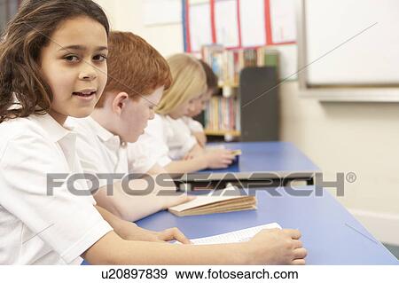 Group Of Children Reading Books In Classroom View Large Photo Image Stock Photo - Group Of Children Reading Books In Classroom. Fotosearch
