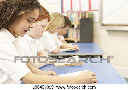 Group Of Children Reading Books In Classroom View Large Photo Image Stock Photo - Group Of Children Reading Books In Classroom. Fotosearch