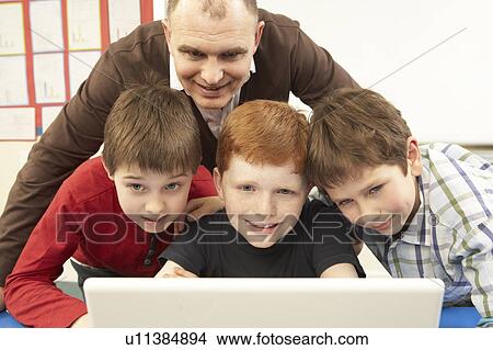 Group Of Schoolboys In IT Class Using Computer View Large Photo Image Picture - Group Of Schoolboys In IT Class Using Computer. Fotosearch