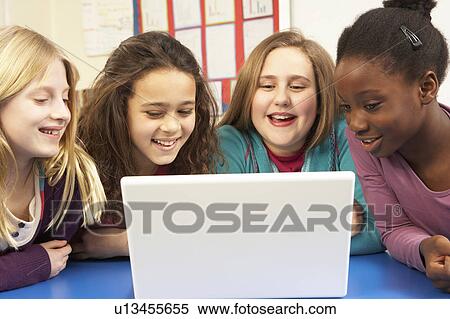 Stock Photography - Group Of Schoolgirls In IT Class Using Computer. Fotosearch