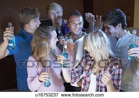 Group Of Teenage Friends Dancing And Drinking Alcohol View Large Photo Image Stock Photo - Group Of Teenage Friends Dancing And Drinking Alcohol. Fotosearch
