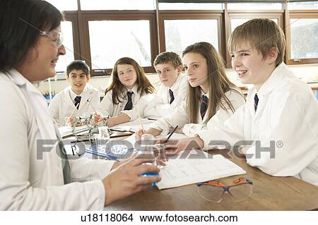 Group Of Teenage Students In Science Class With Tutor View Large Photo Image Picture - Group Of Teenage Students In Science Class With Tutor. Fotosearch