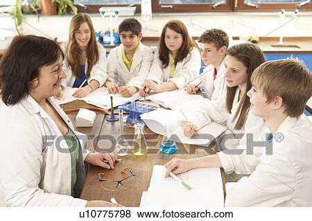 Group Of Teenage Students In Science Class With Tutor View Large Photo Image Stock Photo - Group Of Teenage Students In Science Class With Tutor. Fotosearch