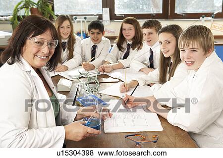 Group Of Teenage Students In Science Class With Tutor View Large Photo Image Stock Photo - Group Of Teenage Students In Science Class With Tutor. Fotosearch