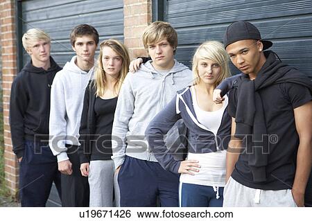Stock Photograph - Group Of Teenagers Hanging Out Together Outside. Fotosearch