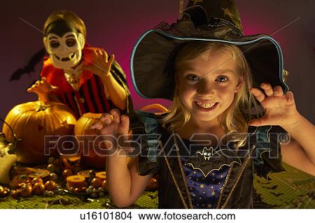 Picture - Halloween party with children wearing scaring costumes. Fotosearch