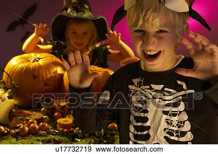Stock Photo - Halloween party with children wearing scaring costumes. Fotosearch