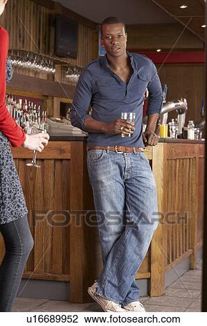 Handsome man in bar View Large Photo Image Stock Image - Handsome man in bar. Fotosearch