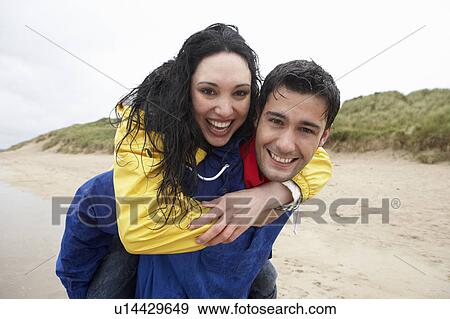 Stock Photo - Happy couple on beach in love. Fotosearch