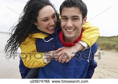 Stock Photo - Happy couple on beach in love. Fotosearch