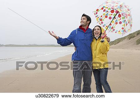 Happy couple on beach View Large Photo Image Stock Photo - Happy couple on beach. Fotosearch