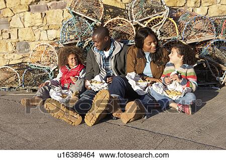 Happy family having picnic View Large Photo Image Picture - Happy family having picnic. Fotosearch