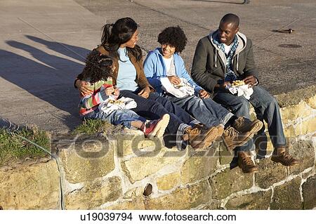 Picture - Happy family having picnic. Fotosearch